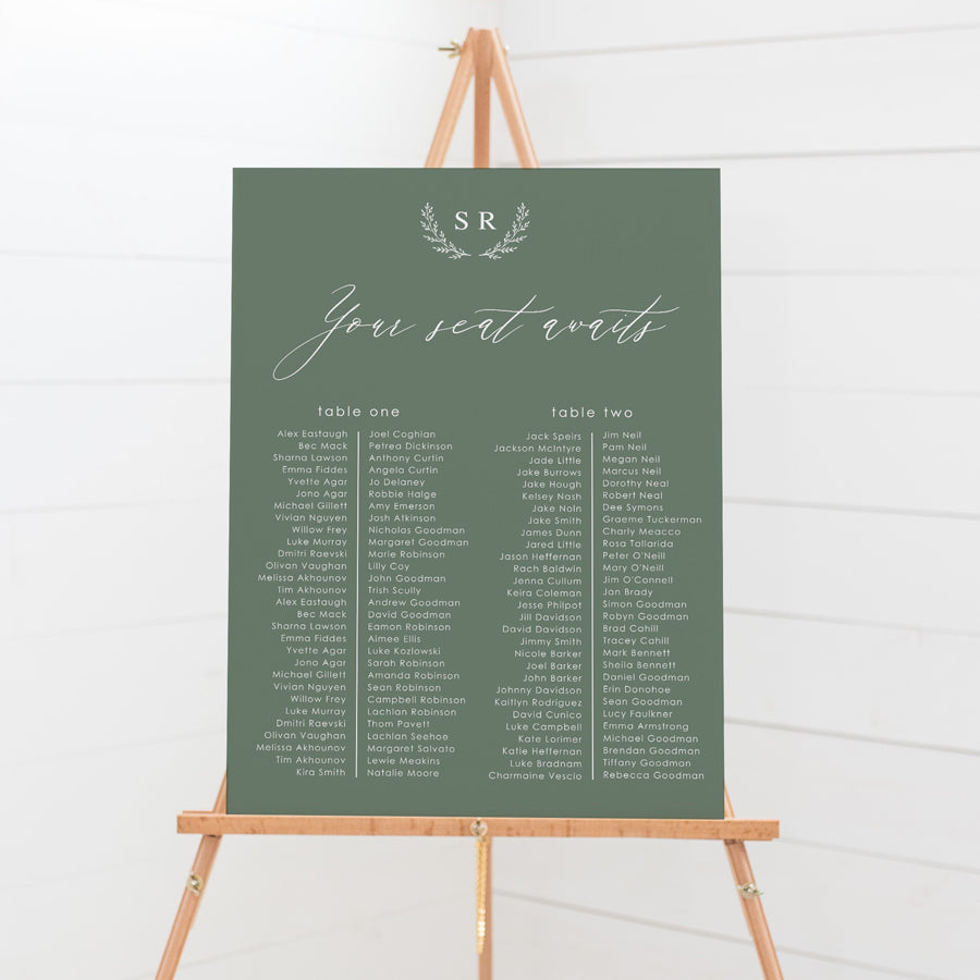 Wedding seating chart with monogram of bride and grooms initials and calligraphy font. Printed on pvc foam board or acrylic.