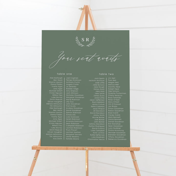 Wedding seating chart with monogram of bride and grooms initials and calligraphy font. Printed on pvc foam board or acrylic.