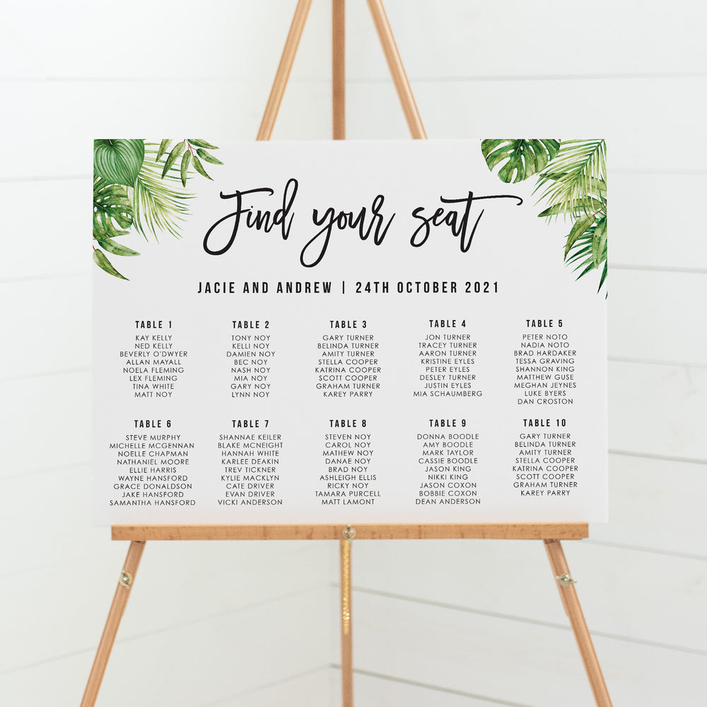 Tropical wedding seating chart with watercolour leaves in corners and modern fonts
