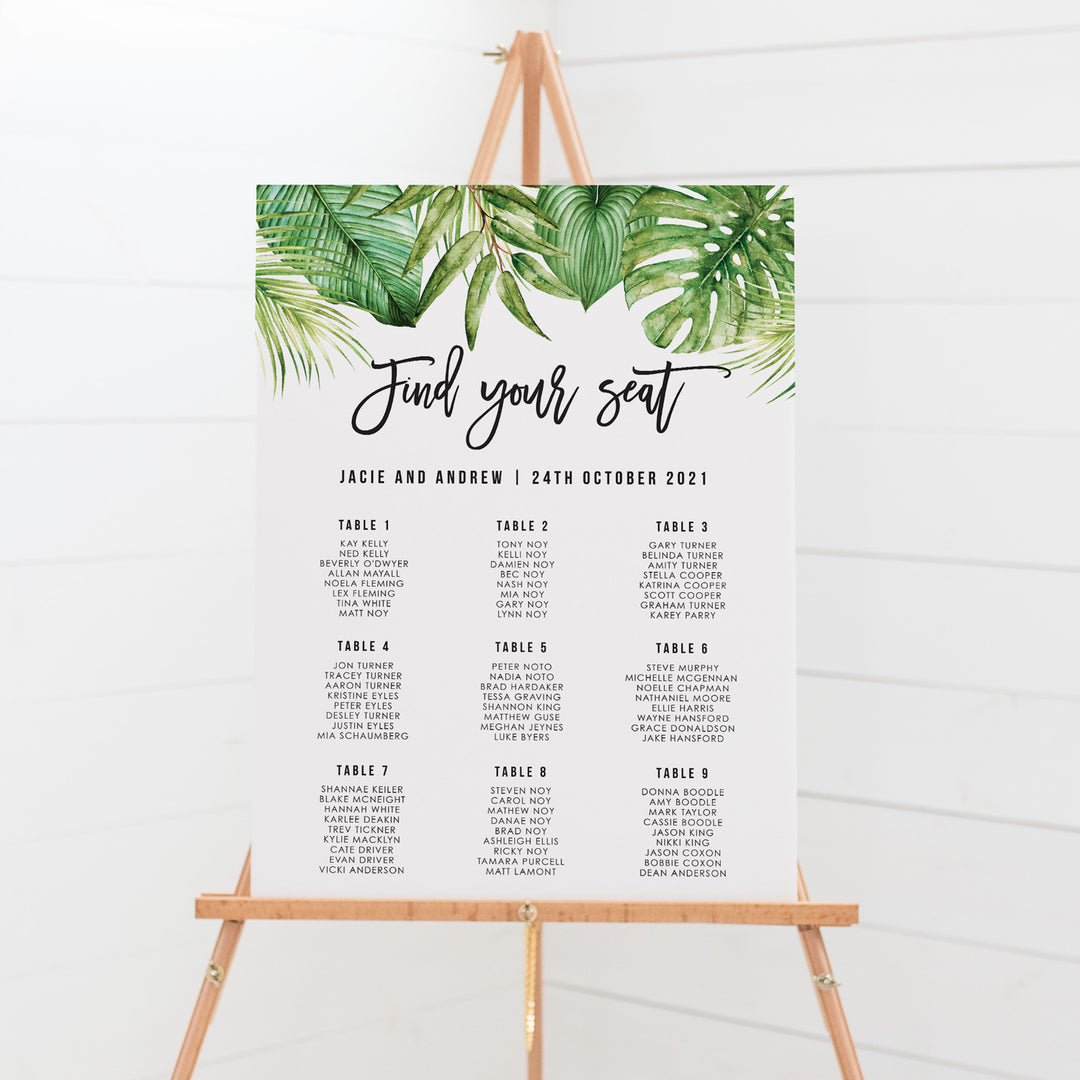Tropical wedding seating chart with watercolour leaves and modern fonts