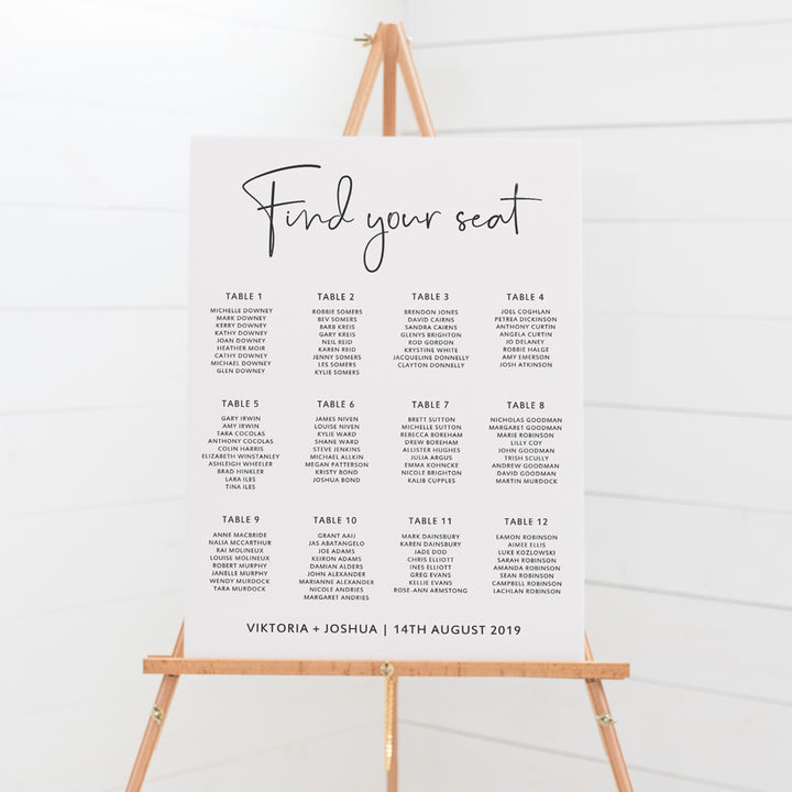 Modern wedding seating chart in charcoal grey and white with script font and 12 tables of guest names