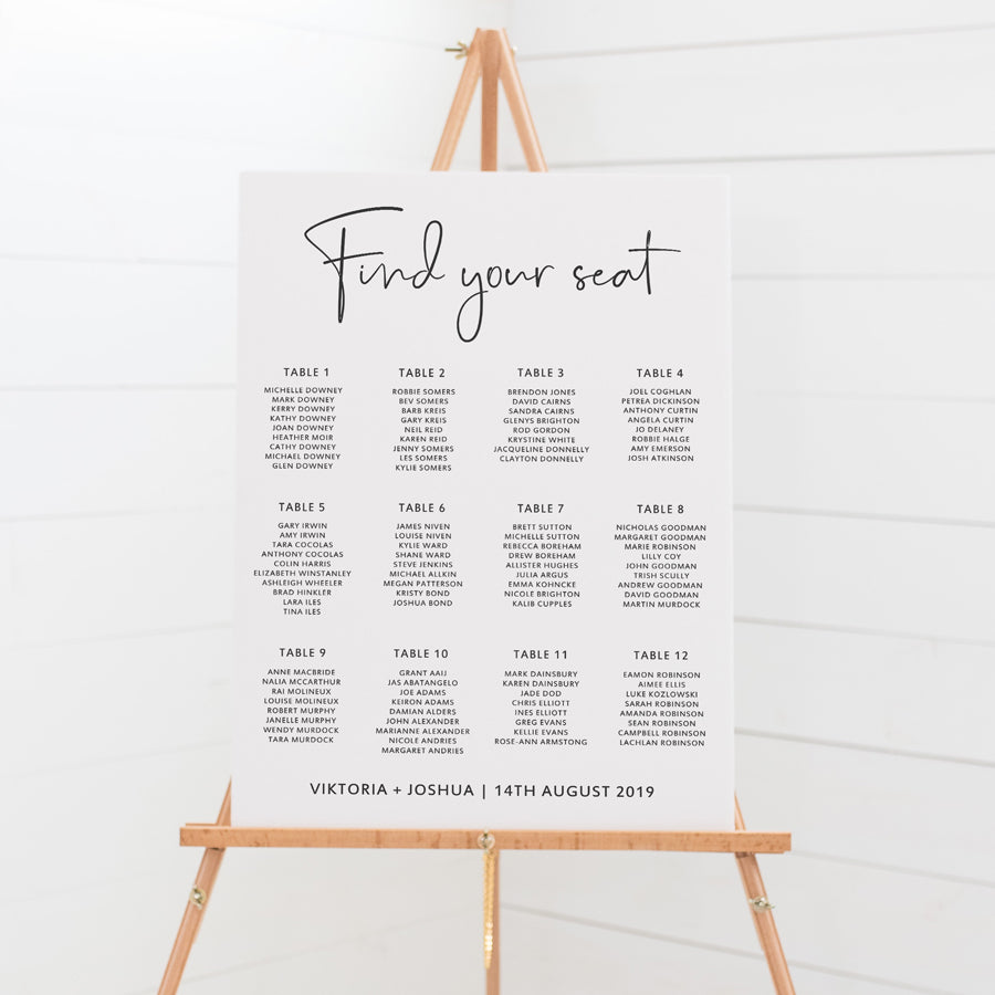 Modern wedding seating chart in charcoal grey and white with script font and 12 tables of guest names