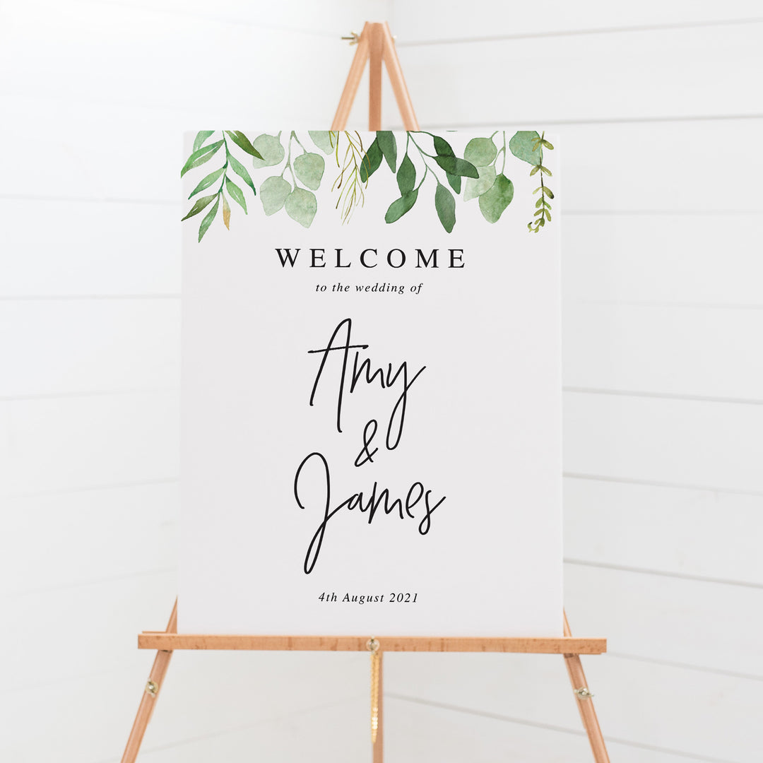 Wedding welcome sign with green leaves and modern script font