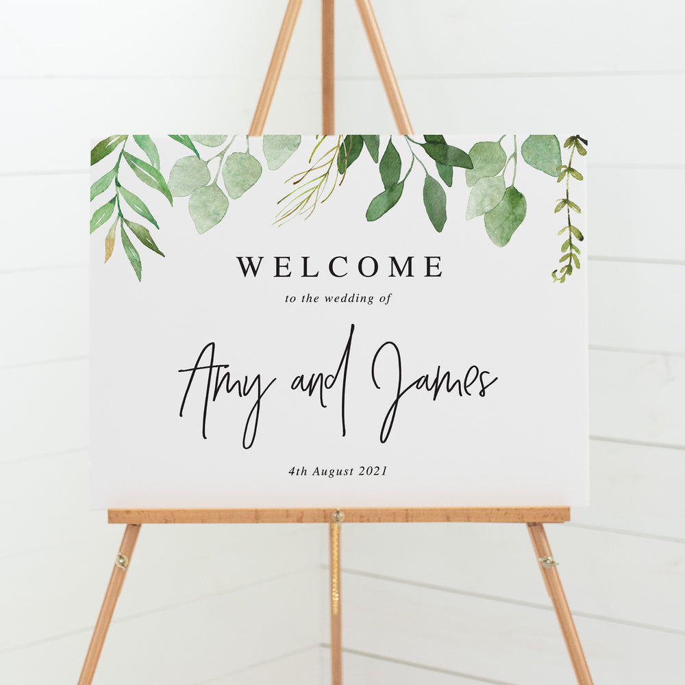 Wedding welcome sign with green leaves and modern script font