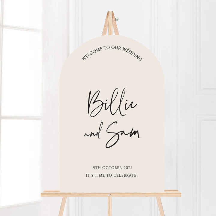 Modern wedding welcome sign in arch shape on easel. Trendy fonts. Almond Cream background.