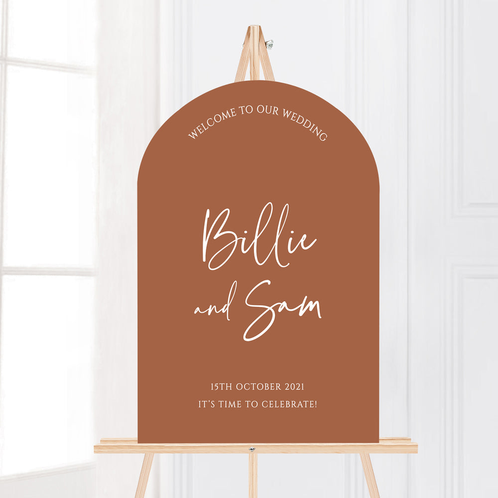 Modern wedding welcome sign in arch shape on easel. Trendy fonts. Terracotta sign.
