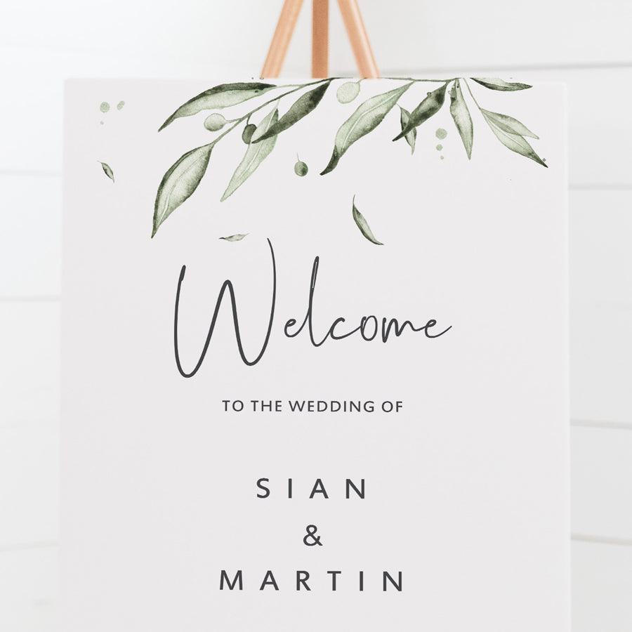Wedding welcome sign with modern script font in charcoal grey and watercolour olive leaves