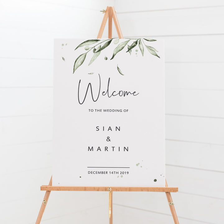 Wedding welcome sign with modern script font in charcoal grey and watercolour olive leaves