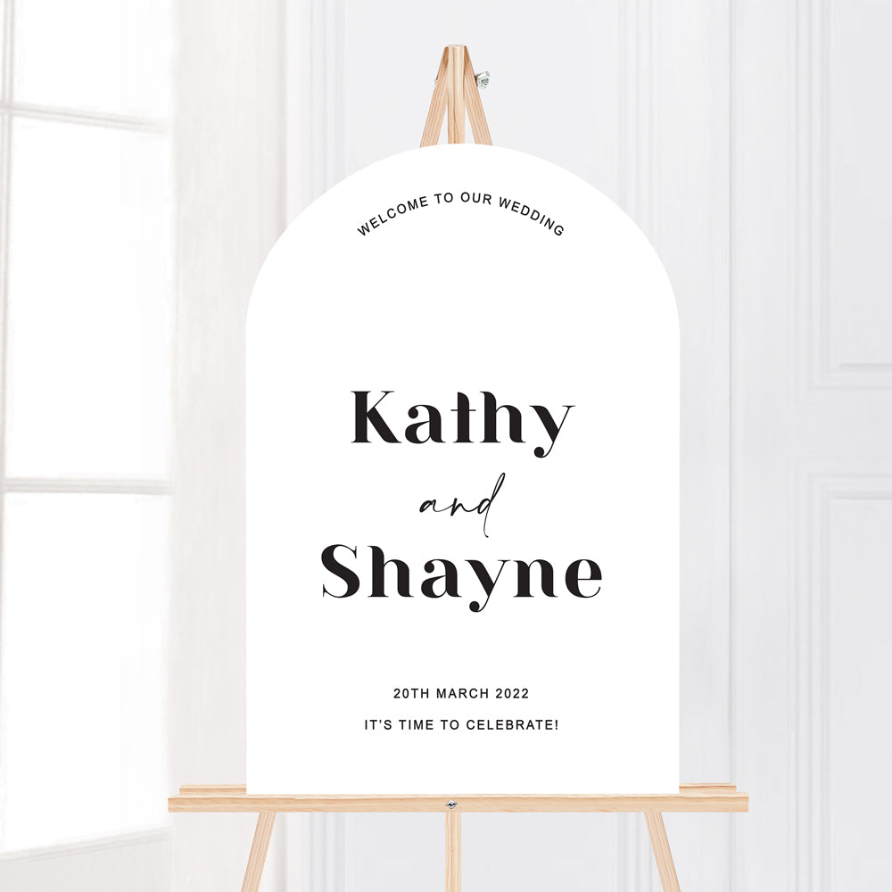 Modern wedding welcome sign in arch shape on easel. Trendy fonts. Black and white.