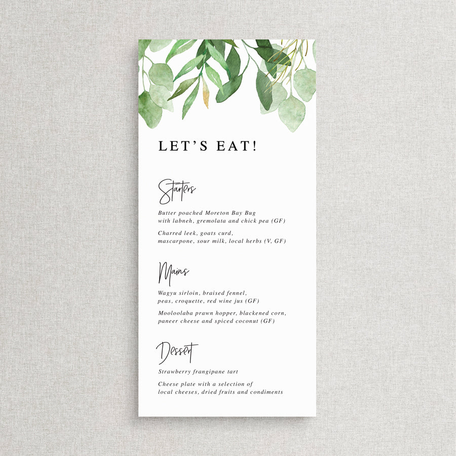 Wedding menu with greenery and eucalyptus leaves and modern font style with Lets Eat for heading.